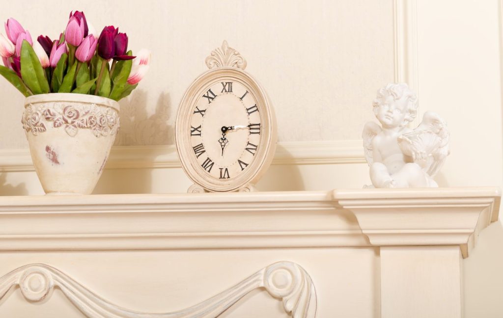 Fireplace Design Ideas: Materials, Colors, Design Styles 13 A few different décor pieces like a vase, clock, and a sculpture