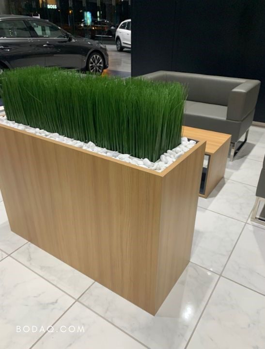 Decorative plant base wrapped with SPW67 Oak interior film