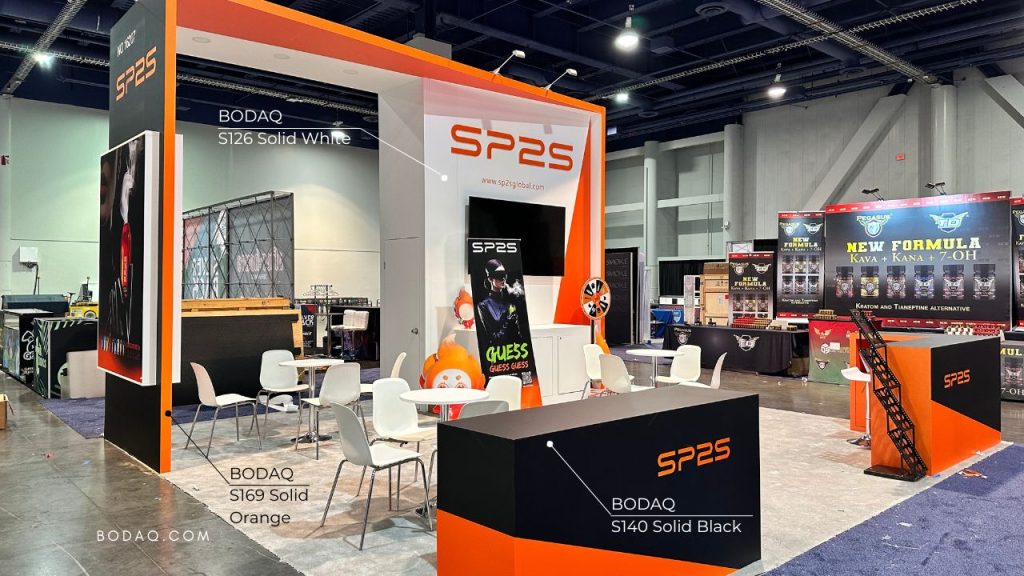 Pop-Ups and Events with Bodaq Interior Film 9 Booth design with Bodaq S140 Solid Black, S169 Solid Orange, and S126 Solid White